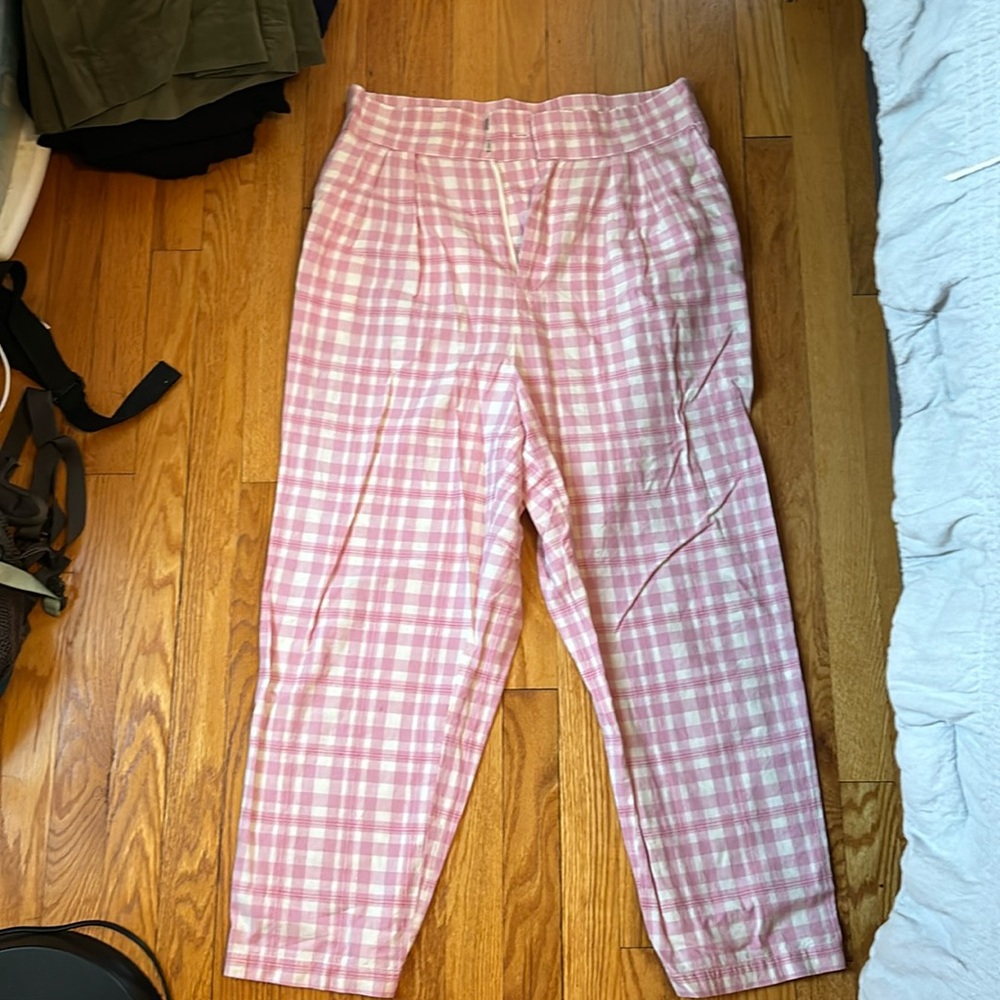 Pink plaid slacks.